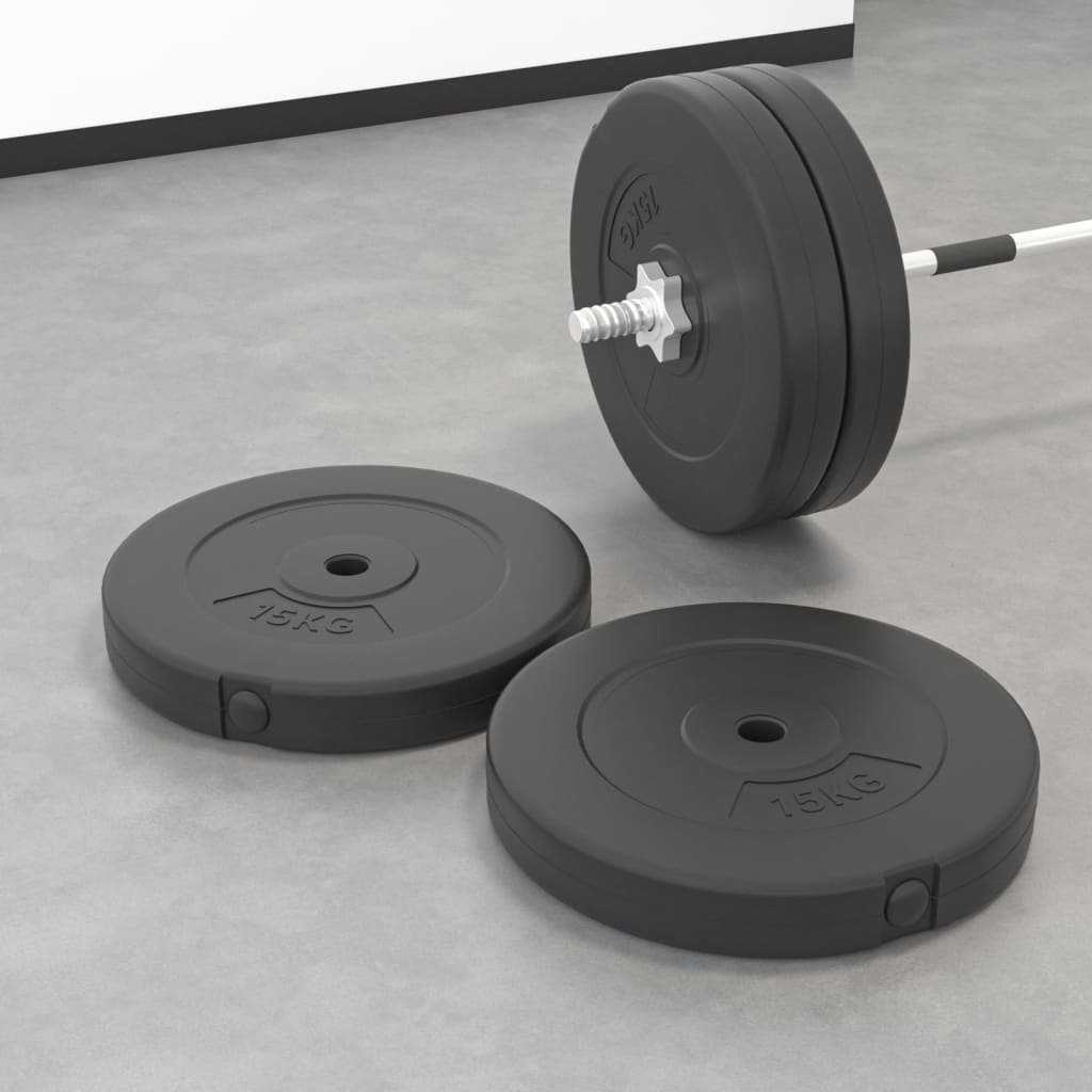 Weight Plates in black rubber material, round with 15 kg marking, paired with a barbell holding multiple plates.
