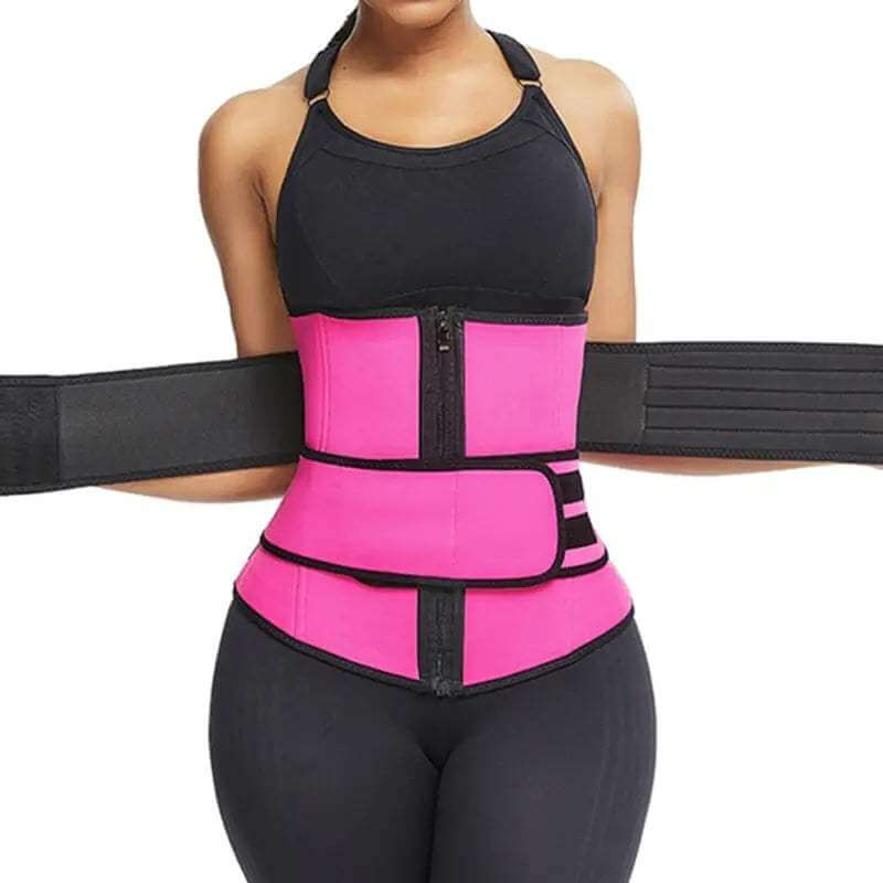 Pink neoprene waist trainer with black trim and adjustable straps worn over black activewear for Weight Loss.